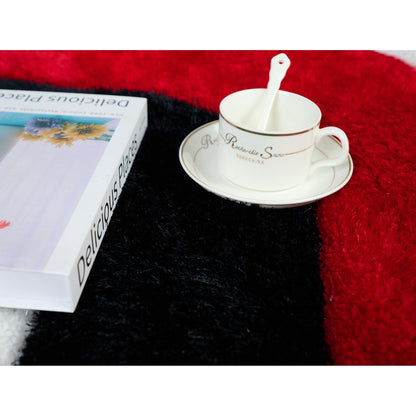 Tapis à poils longs Mateos au design abstrait