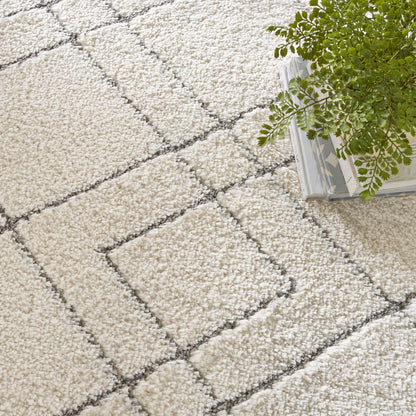 Tapis Nourison luxueux à poils longs et ultra moelleux, motif géométrique abstrait